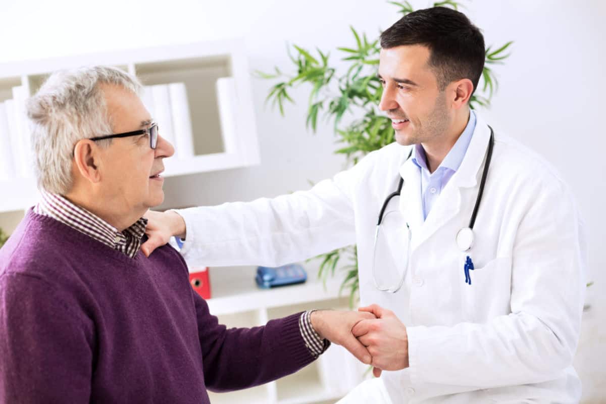 GP managing hypertension and diabetes with patient in consultation